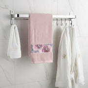 Foldable stainless steel bathroom towel rod with space-saving wall-mounted design